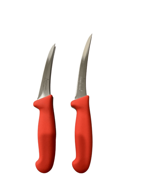 a pair of red scissors sitting next to each other