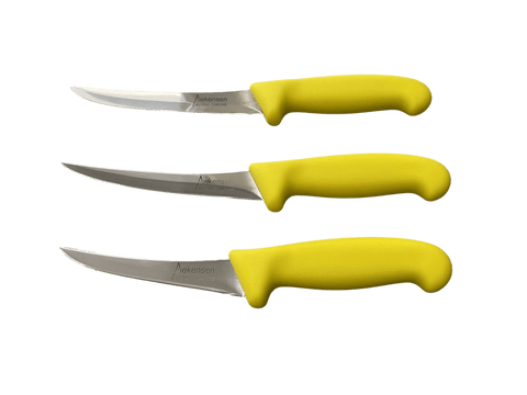 three knives with yellow handles on a black background