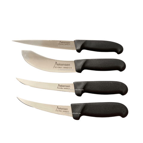three knives sitting side by side on a black background