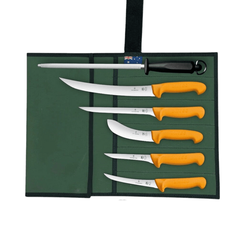 a set of five knives sitting on top of a green case